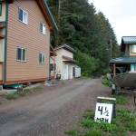 Mark Sabbatini / Juneau Empire
An unofficial 41⁄2-mph speed limit sign implores people to slow down from the official 10 mph limit while driving ATVs and bicycles on the dirt road passing through a trio of family homes on the outskirts of Tenakee Springs. A suggestion to impose an official 5 mph limit in some parts of the community where children frequent has been unsuccessfully made recently to the city council. No cars or trucks, except for two essential public service vehicles, are allowed in the town.