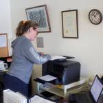 Mark Sabbatini / Juneau Empire
Nicole Pegues, Tenakee Springs clerk and finance officer, copies a document Wednesday at City Hall. As the only full-time municipal government employee in a town of 112 residents, she said her duties extend to other areas of responsibility from meter reading to disaster relief.