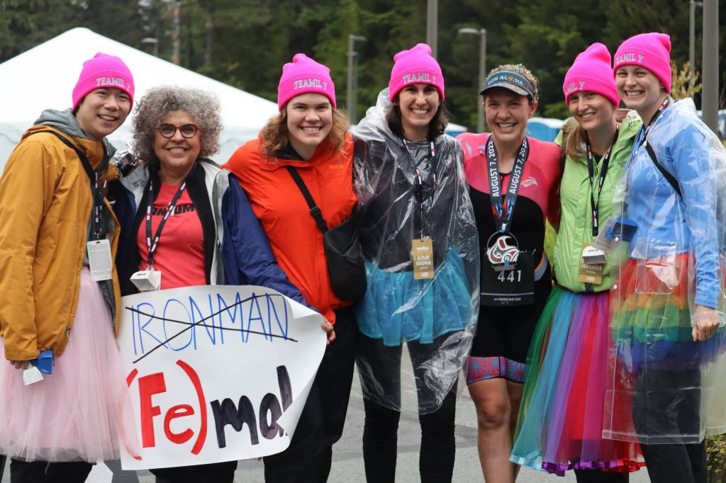 Northtrop family and childhood friends traveled all the way from Miami to see Emily Northrop compete in Juneaus Ironman on Sunday. Northrops mother Anita holds a sign with a creative take on the Ironman name. (Jonson Kuhn / Juneau Empire)