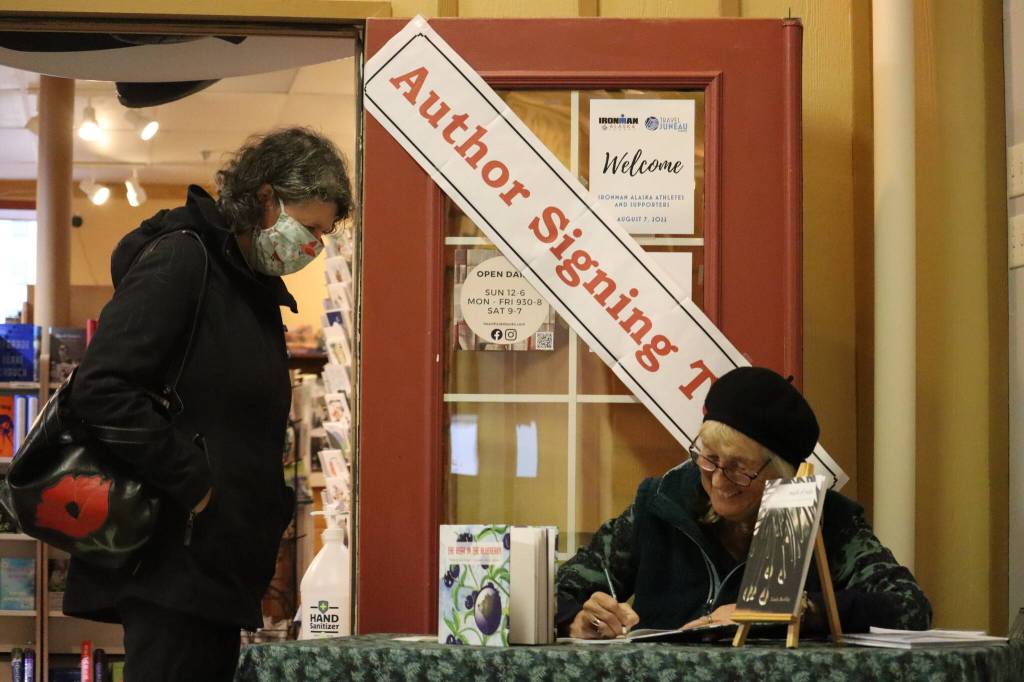 Juneau author and artist Linda Buckley signed copies of her newest book of poetry, Made of Rain in front of Hearthside Books in the Merchants Wharf at 2 Marine Way, suite 119. (Jonson Kuhn / Juneau Empire)