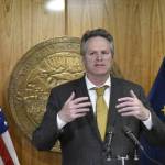 Gov. Mike Dunleavy speaks with reporters about the state's budget at the Alaska State Capitol on Thursday, May 19, 2022. Dunleavy, who received a conditional endorsement from former President Donald Trump, was among the first prominent Alaska politicians to weigh in on the FBI's search of Trump's property. (Peter Segall / Juneau Empire File)