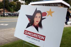 U.S. Senate candidate Shoshana Gungurstein stars in a campaign sign within view of the Alaska governors mansion. Gungurstein, an independent, got exposure this week for being a Hollywood actress under a different last name after questions about her past went unanswered throughout the campaign. She is one of 19 candidates seeking to be among the four selected in next Tuesdays primary to compete in the November general election. (Mark Sabbatini / Juneau Empire)