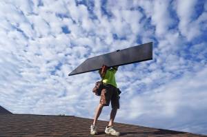 A workman from Power Shift Solar installs a solar panel Thursday, Aug. 11, 2022, in Salt Lake City. Congress is poised to pass a transformative climate change bill on Friday, Aug. 12. The crux of the long-delayed bill is to use incentives to accelerate the expansion of clean energy such as wind and solar power, speeding the transition away from the oil, coal and gas that largely cause climate change. (AP Photo / Rick Bowmer)