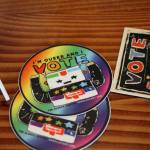 This July 28, 2022, photo shows stickers put out for people during a mock election at Cafecito Bonito in in Anchorage, Alaska, where people ranked the performances by drag performers. Several organizations are using different methods to teach Alaskans about ranked choice voting, which will be used in the upcoming special U.S. House election. (AP Photo / Mark Thiessen)