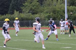 Senior Jarrell Williams throws a pass during Thursdays practice before Saturdays opening game in Anchorage against Dimond High School. (Jonson Kuhn / Juneau Empire)