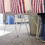 Alaska resident casting her vote at Auke Bay Ferry Terminal among a steady flow of voters in Tuesday mornings primary election.