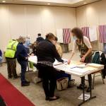 Mark Sabbatini / Juneau Empire
Emily Kane, precinct chair at the Elizabeth Peratrovich Hall polling station, instructs a voter on filling out the ballot for Tuesdays combined special and primary election. Kane, a local election worker since 2016, said there is a high rate of spoiled ballots this year.
