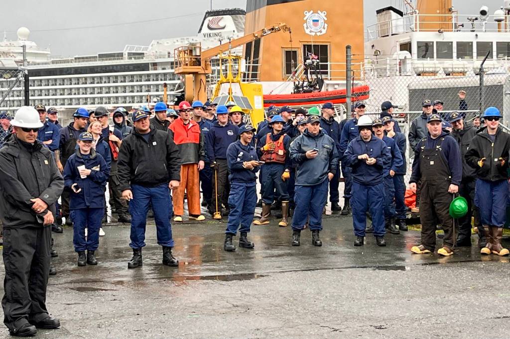 Crew members from various cutters stand in the background in support of their teams during the chain pull competition at this years Buoy Tender Olympics. (Jonson Kuhn / Juneau Empire)