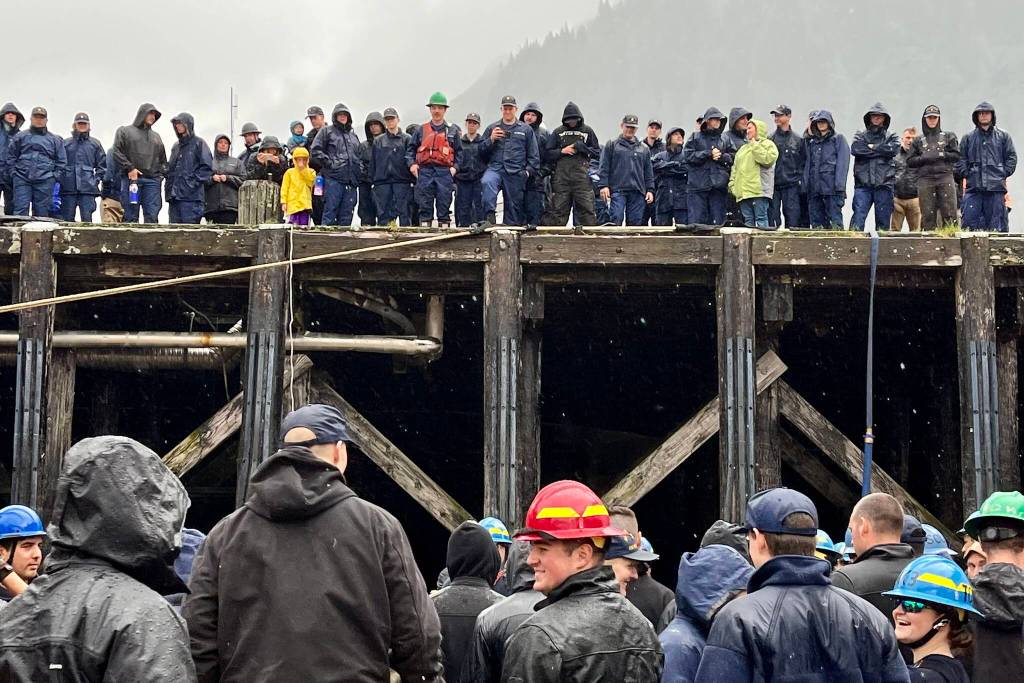 Despite the pouring rain, everyone still gathered high and low to cheer on different teams as they battled it out during the heat and beat competition for the annual Buoy Tender Olympics on Wednesday. (Jonson Kuhn / Juneau Empire)