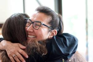 Democratic U.S. House Candidate Mary Peltola hugs a supporter during a campaign event in Juneau on Friday. Peltola emerged as the top finisher in the first round of results on election night, but is facing two better-known Republican challengers who may prevail when the new ranked choice ballots get a final tabulation Aug. 31. (Mark Sabbatini / Juneau Empire)