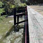 A line where the Montana Creek Bridge deviates from true, damaged by recent weather. (MIchael S. Lockett / Juneau Empire)