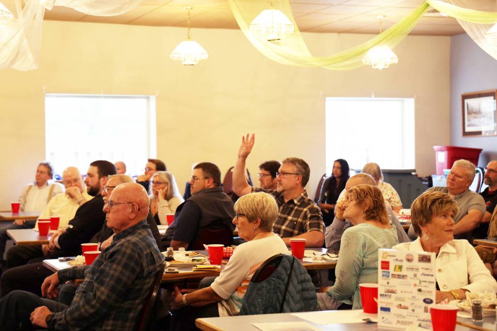 City and Borough of Juneau Assembly member Wade Bryson looks to principal architect at NorthWind Architects, Sean Boily as he speaks in favor of the building of a new city hall. The proposed building would move the location of the current city hall over to Whittier Street, across the street from the state museum. The total project is estimated to cost around $41.3 million, which would require the $35 million bonds along with $6.3 million to be pulled from general funds, an amount that the Assembly has already allocated. (Clarise Larson / Juneau Empire)