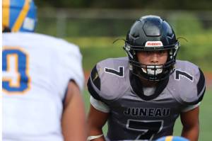 Running back Jamal Johnson eyes the end zone from behind the line of scrimmage during a win against Bartlett High School. (Ben Hohenstatt / Juneau Empire)
Running back Jamal Johnson eyes the end zone from behind the line of scrimmage during a win against Bartlett High School. (Ben Hohenstatt / Juneau Empire)