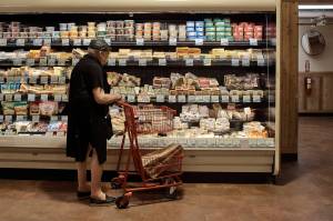 A man shops at a supermarket on Wednesday, July 27, 2022, in New York.  An inflation gauge that is closely tracked by the Federal Reserve, Friday, July 29,  jumped 6.8% in June from a year ago, the biggest increase in four decades, and leaving Americans with no relief from surging costs.    (AP Photo /Andres Kudacki)