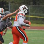 Juneaus Jamal Johnson (7) catches up to Wests Toby Miller (3) during the Huskies win on Saturday. (Ben Hohenstatt / Juneau Empire)