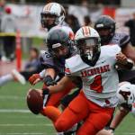 Juneaus Eric Tipton (88) puts pressure on Wests Pookela Puaoi who would manage to evade the Juneau defender. The Huskies defense was formidable throughout the game and held the Eagles scoreless. (Ben Hohenstatt / Juneau Empire)