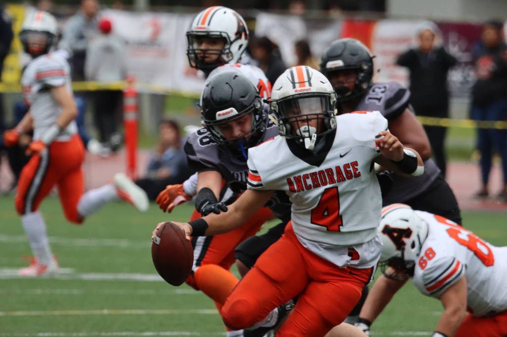 Juneaus Eric Tipton (88) puts pressure on Wests Pookela Puaoi who would manage to evade the Juneau defender. The Huskies defense was formidable throughout the game and held the Eagles scoreless. (Ben Hohenstatt / Juneau Empire)