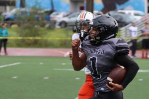 Jarrell Williams streaks down the sideline for Juneau's second touchdown of the game. The Huskies are now 3-0 on the season with each win coming against other Cook Inlet Conference teams. (Ben Hohenstatt / Juneau Empire)