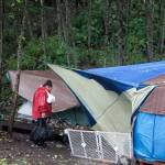 Mark Sabbatini / Juneau Empire 
Shelly Stevens carries groceries from a food pantry to her tent at Mill Campground on Monday. She has been homeless for the past 10 years, saying that raising four children kept her from the workplace and her addiction problems since have been an ongoing struggle.