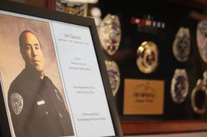 Jonson Kuhn / Juneau Empire 
In recognition of Officer Jim Quintos 25 years of service he was presented with two flags that were flown over the Alaska State Capitol, as well as a shadowbox containing Quintos many badges and awards on Friday at his retirement ceremony at the Juneau Police Department.