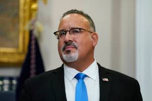 Education Secretary Miguel Cardona listens as President Joe Biden speaks about student loan debt forgiveness in the Roosevelt Room of the White House, Wednesday, Aug. 24, 2022, in Washington. The Department of Education recently announced $35 million in grants to support Alaska Native education projects in the state. “I am excited to announce 28 new Alaska Native Education program projects, which will help better meet the needs of Alaska Native students at this critical moment and continue to strengthen the relationship between the Department and Alaska Native Organizations,” said Cardona in a statement. (AP Photo/Evan Vucci)