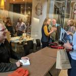 In this October 2018 photo, author John Straley prepares to sign a book for author Heather Lende after the Alaska Literary Festival at the Father Andrew P. Kashevaroff Building in Juneau. They were both speakers at the event. Straley is a former Alaska State Writer Laureate, while Lende is the current State Writer Laureate. (Ben Hohenstatt / Juneau Empire File)
