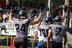 Senior MJ Topou (24) had his first big catch of the year against Colony High School in Anchorage with a 66-yard reception. The Huskies next host West Valley Eagles of Washington state on Friday at 7 p.m. (Ben Hohenstatt / Juneau Empire File)