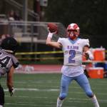 West Valley quarterback Skyler Cassel prepares to throw a pass while under pressure from the Huskies defense. Throughout the game, Cassel proved to be evasive, often extending plays and eluding the Juneau rush. (Ben Hohenstatt / Juneau Empire)