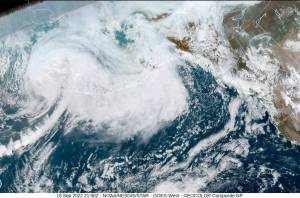 This image provided by the National Hurricane Center and Central Pacific Hurricane Center/National Oceanic and Atmospheric Administration shows a satellite view over Alaska, Thursday, Sept. 15, 2022. A vast swath of western Alaska could see flooding and high winds as the remnants of Typhoon Merbok move toward the Bering Sea region. The National Weather Service had in place coastal flood warnings, beginning Friday, spanning from parts of the Yukon Delta in southwest Alaska up to St. Lawrence Island in the Bering Sea and to the Bering Strait coast. (NOAA via AP)