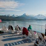 Passengers lounge on the dock of an Alaska Marine Highway System ferry as it departs Juneau in this photo posted Sept. 1 at the AMHS Facebook page. (Alaska State Department of Transportation and Public Facilities)