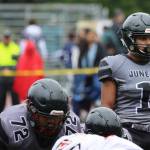 Jarrell Williams, who scored five TDs against South Anchorage to help Juneau maintain an undefeated record, looks over the line of scrimmage in an Aug. 27 game against West Anchorage High School. (Ben Hohenstatt / Juneau Empire File)