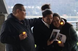 David Evenson stood with his family Latavia Lofftus and Marilyn Willard to remember Felicia Evenson at the Candlelight Vigil & Memorial Walk held by Tlingit and Haida and SouthEast Alaska Regional Health Consortium on Saturday at the Marine Park Pavilion. (Jonson Kuhn / Juneau Empire)