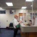 Mark Sabbatini / Juneau Empire 
Kelsey Martin asks about the status of her sons Permanent Fund Dividend check after arriving first at Juneaus PFD office in the State Office Building on Tuesday, the first day direct deposit payments of the $3,284 dividends are being credited. Eligible residents who did not receive direct deposits will be paid by checks that will be mailed starting Oct. 6.