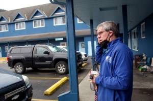 Dave Ringle, executive director of the Society of St. Vincent de Paul in Juneau, removes a face mask after exiting transitional housing Wednesday at the organizations complex on Teal Street, where a public open day will be part of an annual fundraiser Saturday. The complex is in the midst of various upgrades and Ringle said the fundraiser is intended to help both the projects and provide direct aid to residents. (Mark Sabbatini / Juneau Empire)