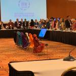 Attendees of a government-to-government consultation look on as kuspuks were displayed during the Violence Against Women Tribal Consultation held this week in Anchorage. (Courtesy Photo / Lisa Houghton)