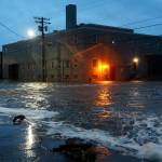 Water rushes down Front Street, just a half block from the Bering Sea, in Nome, Alaska, on Saturday, Sept. 17, 2022 as the remnants of Typhoon Merbok moved into the region. It was a massive storm system  big enough to cover the mainland U.S. from the Pacific Ocean to Nebraska and from Canada to Texas. It influenced weather systems as far away as California, where a rare late-summer storm dropped rain on the northern part of the state, offering a measure of relief to wildfire crews but also complicating fire suppression efforts because of mud and loosened earth. (AP Photo / Peggy Fagerstrom)