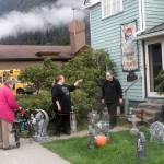 Mindy and Will Jones, who lived next door to Resurrection Lutheran Church, talk to neighbor Elva Bontrager in their yard on Wednesday. The couple said they are sympathetic to disadvantaged residents staying at the church’s warming shelter during sub-freezing winter nights, but there have been incidents with people being loud and rowdy outside late at night. The church provided the warming shelter for the first time last winter and on Tuesday the city approved extending the number of days and hours the shelter can be open during the coming winter.  (Mark Sabbatini / Juneau Empire)
