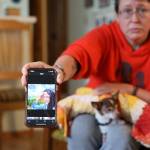 Clarise Larson / Juneau Empire
Michelle Rogers holds out her phone showing a painted portrait of Faith Rogers that was created by a friend. Family members described Faith Rogers as kind, loving, artistic and outdoorsy.