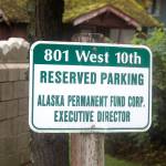 A parking sign awaits the new executive director of the Alaska Permanent Fund at its Juneau headquarters, Three finalists will be interviewed for the job during a public meeting Monday by the funds board of trustees, who are expected to deliberate and announce the new director immediately afterward. (Mark Sabbatini / Juneau Empire)