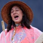 Jamiann Seiltin Hasselquist, vice president of Juneaus Alaska Native Sisterhood chapter, sings and drums Friday morning during an Orange Shirt Day event held in the Mendenhall Wetlands parking area. Hasselquist said the location was chosen for its high visibility. (Ben Hohenstatt / Juneau Empire)