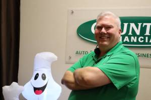 Emily Mackey smiles for a photo at his office in the Nugget Mall. Mackey is seeking a third term on the Juneau School District Board of Education. (Clarise Larson / Juneau Empire)