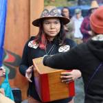 Shavings of wood with names on them are collect and were brought to the fire pit to be burned during the event. (Clarise Larson / Juneau Empire)