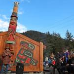 Tlingit master carver Wayne Price stands next to his wife, Cherri, in front of the healing totem pole and screens he created. Hundreds of people gathered in raincoats and boots at the Twin Lakes Kaasei Totem Plaza to witness the two-hour ceremony. (Clarise Larson / Juneau Empire)