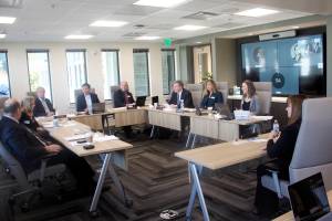 Melanie Hardin, right, greets the Alaska Permanent Fund Corp.s Board of Trustees before her interview for the APFCs executive directors job Monday in Juneau, (Mark Sabbatini / Juneau Empire)