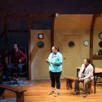 From left to right, actors Jake Waid (John), Xáalnook Erin Tripp (Rose) and Kenny Ramos (Anthony) share the stage as a scene shifts from one conversation to another. Where the Summit Meets the Stars is driven by music, dance and the culture of the Tlingit people and is the 44th season opener for Perseverance Threatre. (Clarise Larson / Juneau Empire)