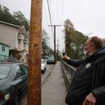Clarise Larson/ Juneau Empire
Lionel Brown points down Gastineau Avenue on Thursday morning. He said it was a normal routine to walk down the street most mornings, but had to change his route for a while debris cleanup was underway.
