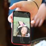 Clarise Larson/ Juneau Empire
Harmony Wentz, Faith Rogers daughter, holds out her phone to show a photo of the pair sharing a hammock. According to Juneau Police Department spokesperson Erann Kalwara, authorities are working to identify a suspect responsible for Rogers death.
