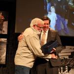 Jerry Harmon accepts his Lifetime Achievement Award for his contribution to the Juneau community as a founder and the president of Juneau Gold Rush Days, a miner for more than 40 years and a volunteer across numerous projects and boards in Juneau.(Clarise Larson / Juneau Empire)