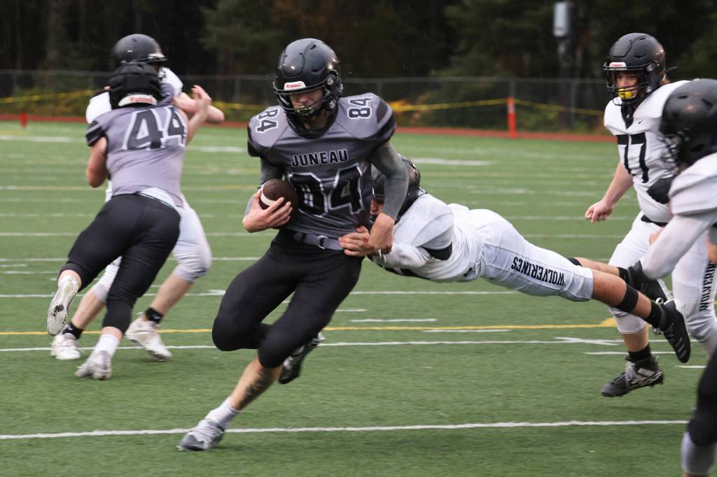 Thomas Baxter runs through an arm tackle on his way to the end zone in the fourth quarter of Saturdays Huskies win.