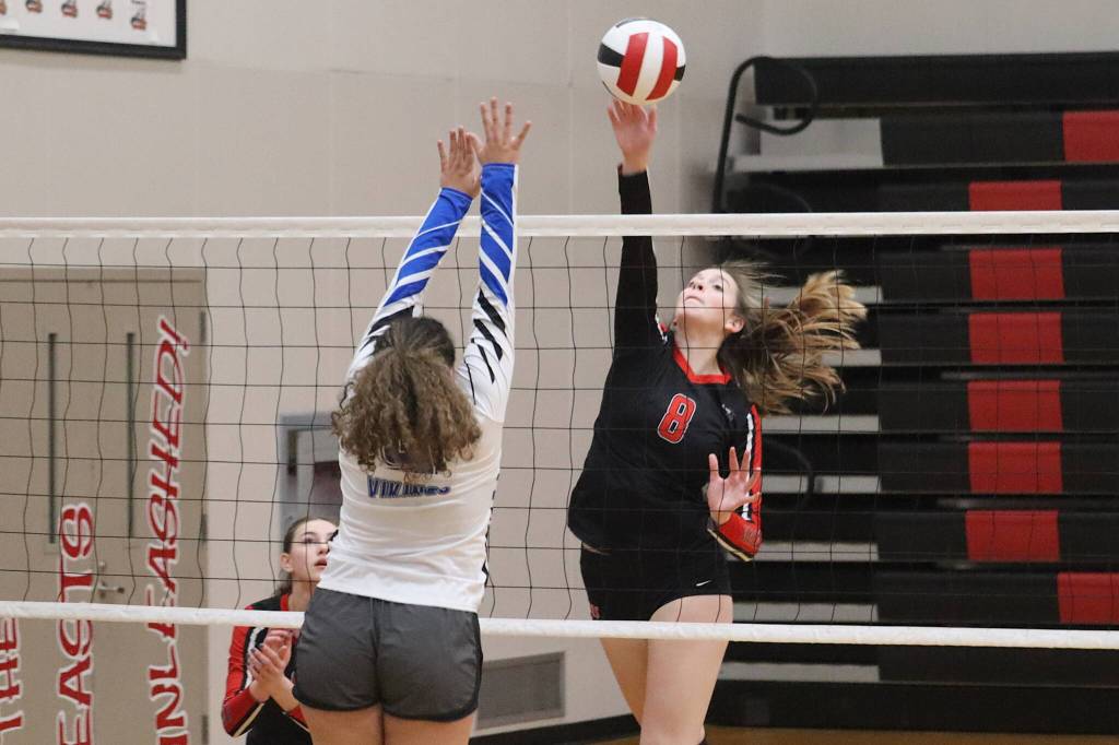 Mila Hargrave of Juneau-Douglas Yadaa.at Kalé High School hits the ball past a Sitka High School player during the opening game of the Gold Bracket matchups of the Juneau Invitational Volleyball Extravaganza on Saturday. Hargrave was among three local players named to the 10-member all-tournament team. (Mark Sabbatini / Juneau Empire)
